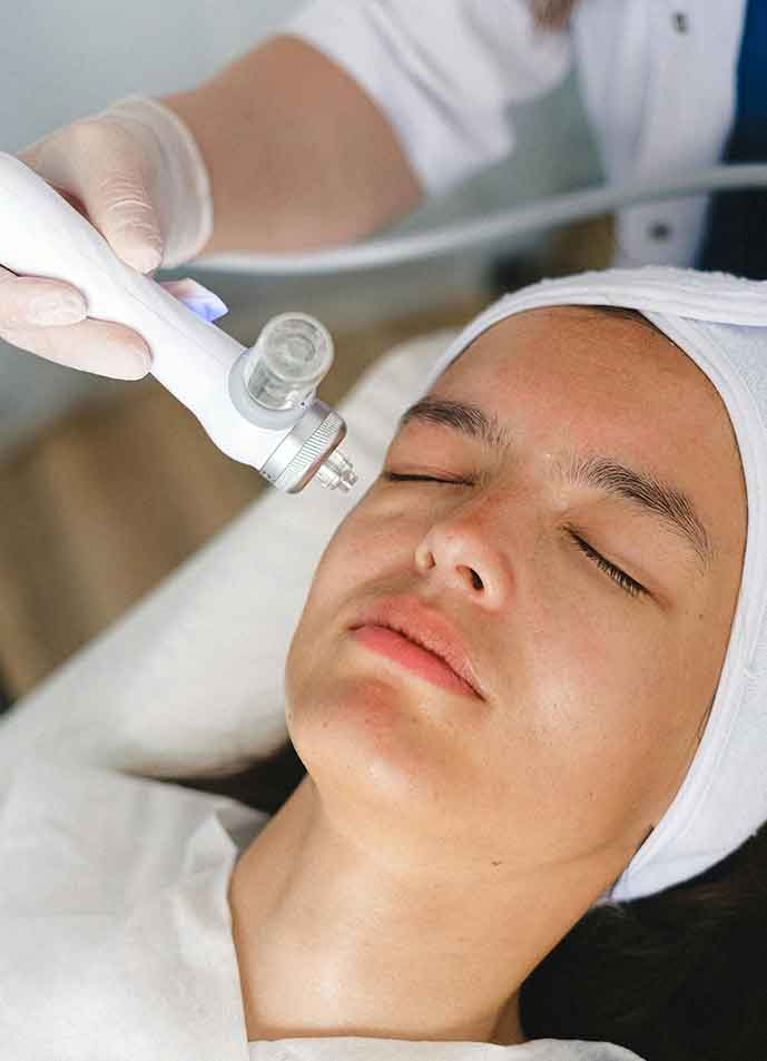 Patient with eyes closed receiving treatment